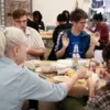 people working on bowls at a ceramics workshop in the ceramics facilities