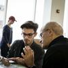 A Tyler architecture student and professor talking.