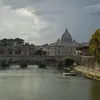 View of a river and a bridge in Rome with buildings in the background