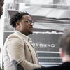 An architecture student talking to people.