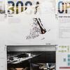 Posters hung up on a wall, displaying architecture plans