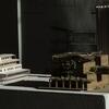 An architecture model displayed on a white table.