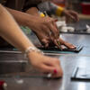 Tyler student's hands as they work on printmaking.