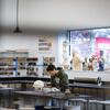 A tyler ceramics student working in a studio inside Tyler.