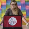 design student poses with "I Voted" sticker design used by Philadelphia