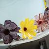 Small glass flowers in a line.