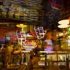 Neon signs and window reflections at Reading Terminal Market