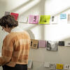 A Tyler art education student looking at a book.