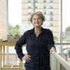 Photo of Kate Wingert-Playdon wearing a blue shirt, looking at the camera