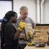 A Tyler landscape architecture student using woodshop.