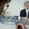 A student painting on a canvas.