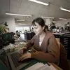 A tyler design graduate student working inside a graduate studio space.