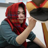 A Tyler student painting a project.