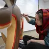 student working on art for the Elmwood Park Zoo