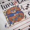 A decorated S on a manuscript.