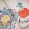 An illustration of apples inside a book.