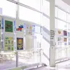 A hallway filled with design posters.