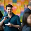 A design instructor smiling and laughing at Tyler networking event.