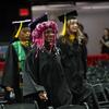 Tyler alumni students walking at graduation.