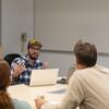 A small group having a discussion in class.