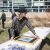 Student and instructor making a cyanotype in Tyler courtyard