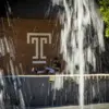 Temple campus in the summer with a fountain in the foreground