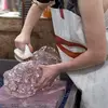 a student cleaning their glass project