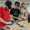 3 students collaborating on a design build workshop