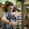 A Tyler ceramics student at art market.
