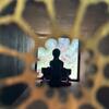 A detail shot of the view inside a laser-cut wood view with mixed media inside