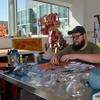 A graduate student working in a studio.