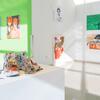 Student work displayed on the walls and podiums.