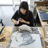 Architecture student working on a model