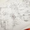 A sketch of an architectural floorplan, featuring detailed lines and measurements that outline the layout of rooms, walls, and spaces. The design is clean and precise, capturing the overall structure of the building.