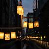 Traditional Japanese lanterns lit up at night.