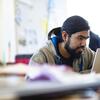 A Tyler student on a computer.